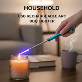 USB rechargeable arc BBQ lighter being used to light a candle on a table.