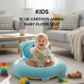 Child sitting on a blue cartoon animal baby floor seat