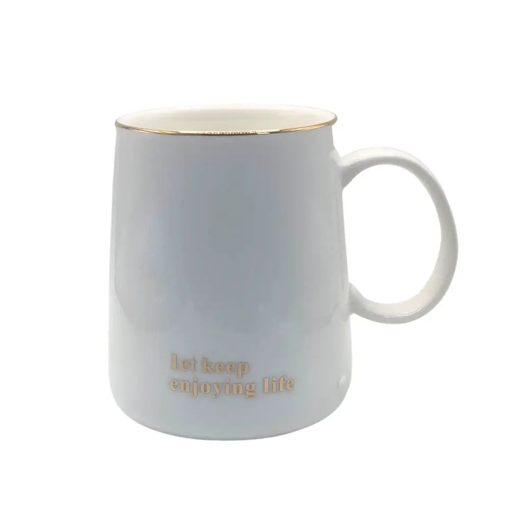 White mug with gold interior and 'let keep enjoying life'