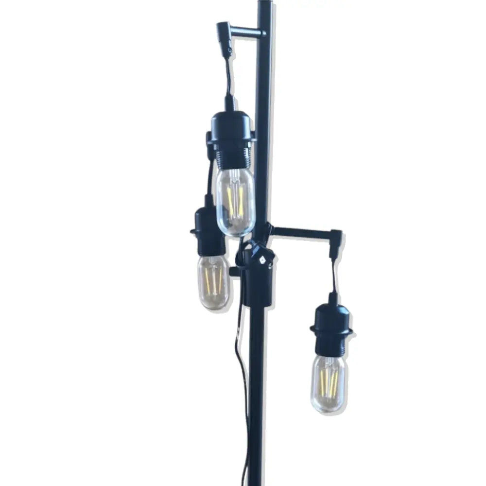 Modern floor lamp with three exposed light bulbs