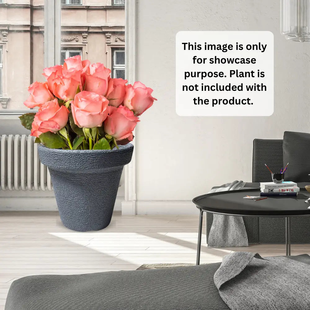 Gray textured planter with pink roses in a living room setting