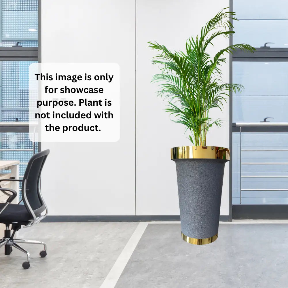Gray planter with gold ring on a desk in an office setting