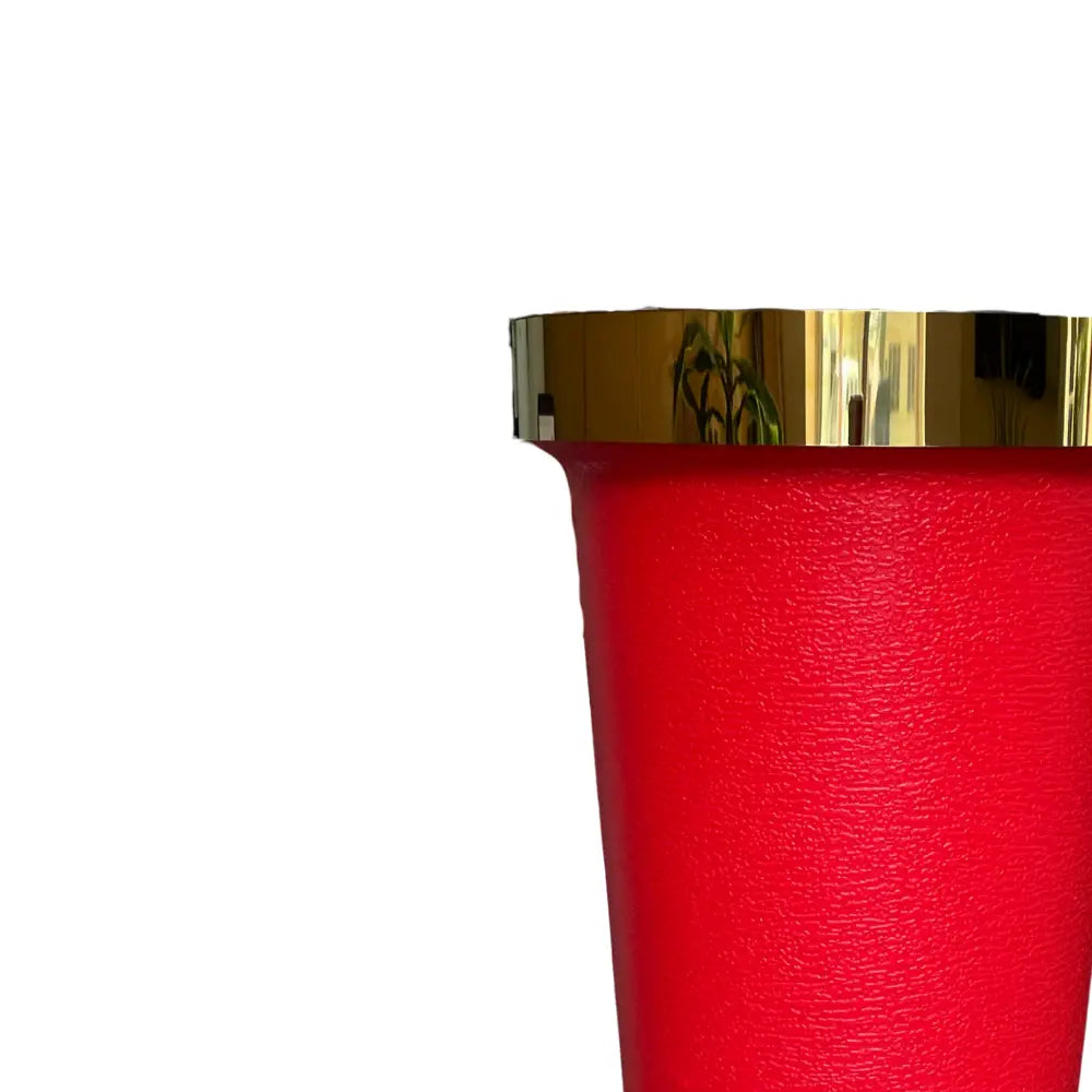Red textured vase with a gold rim