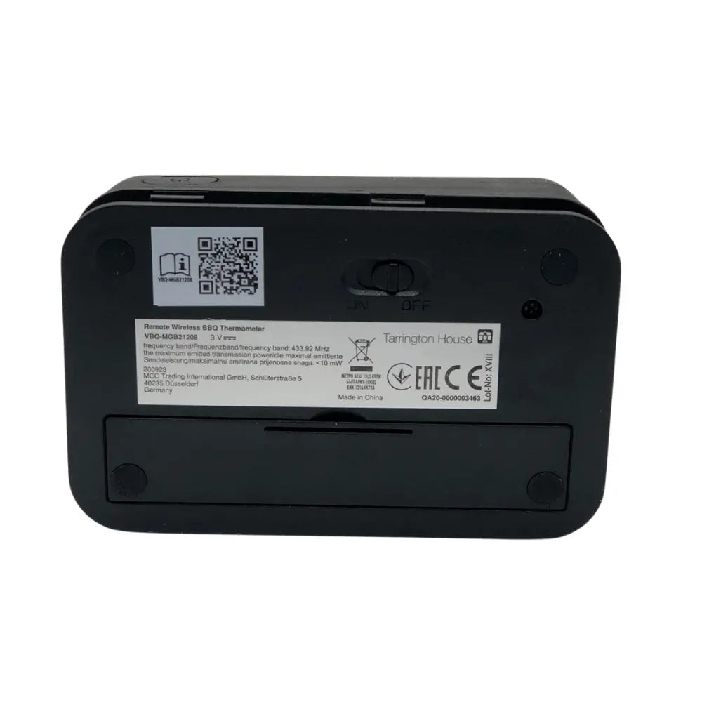 Black electronic thermometer device back side with batteries placement area