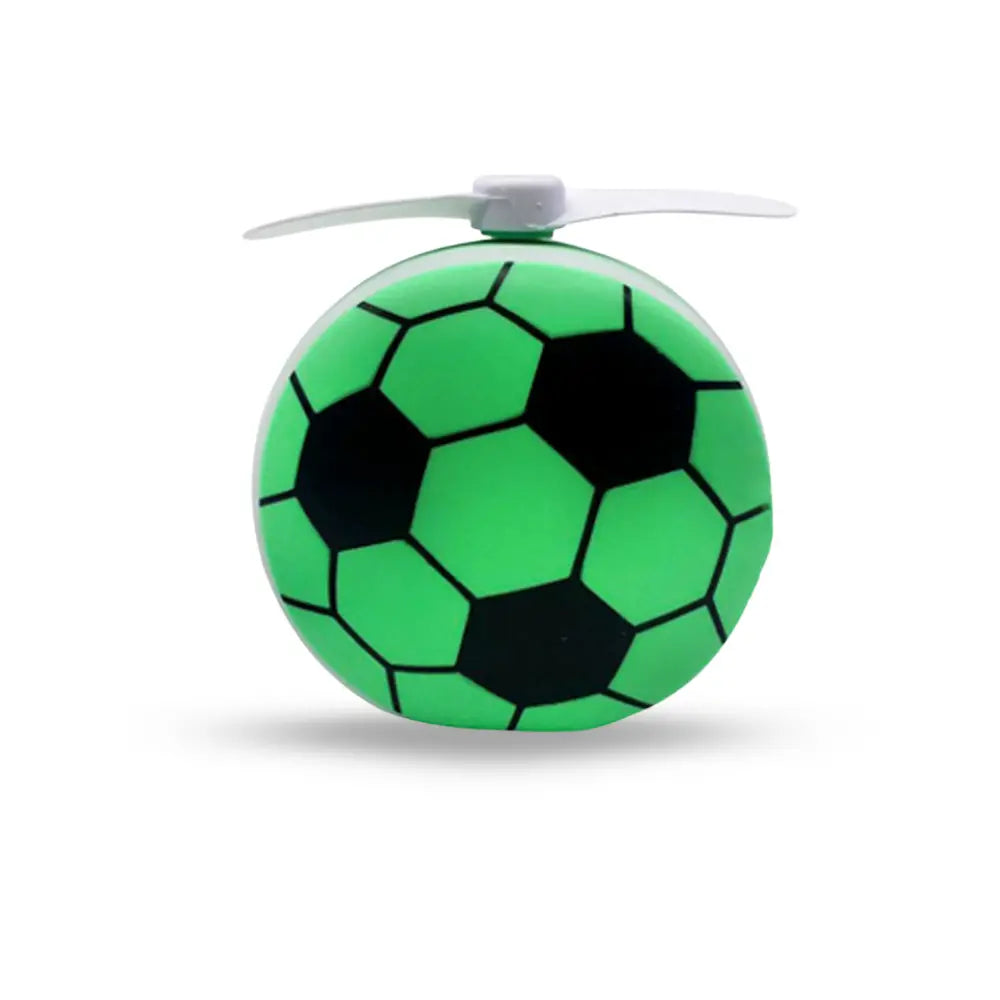 Green soccer ball-shaped toy with a white propeller 
