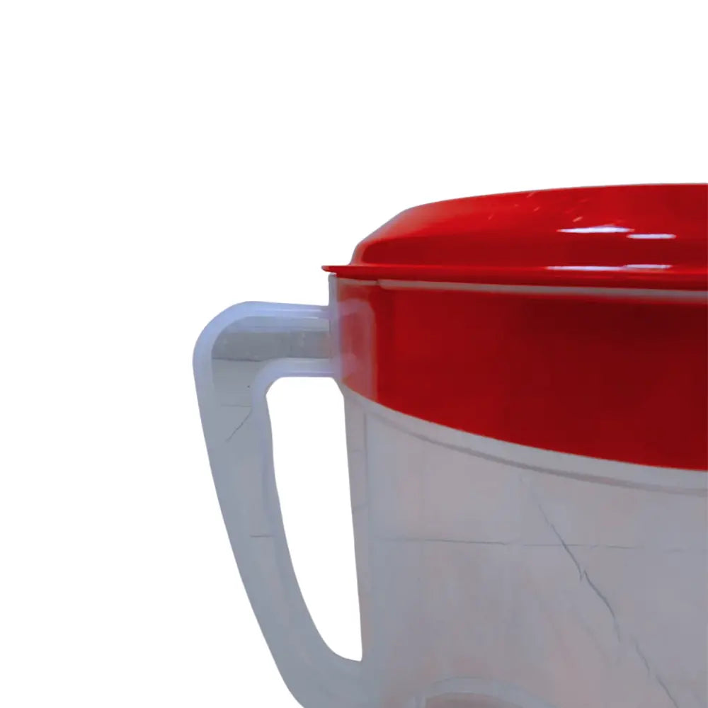 pitcher with a red lid and handle